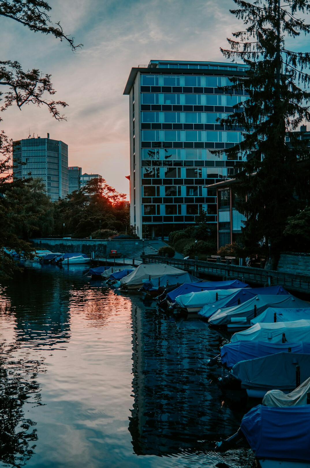 Skyline of Zurich financial district reflecting in the river at dusk